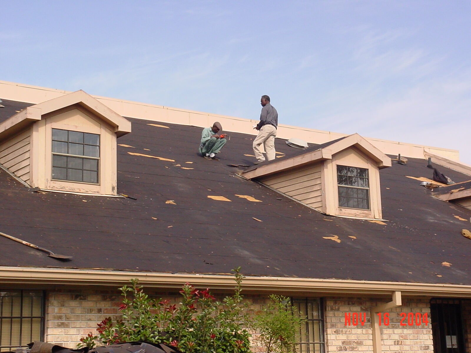 Willie and James Mackie, up on the roof in 2004